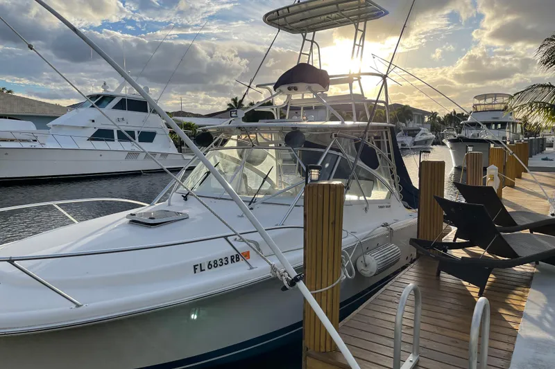 Slide: The Image of 2007 Luhrs 28 Open boat docked at marina during sunset. - 82