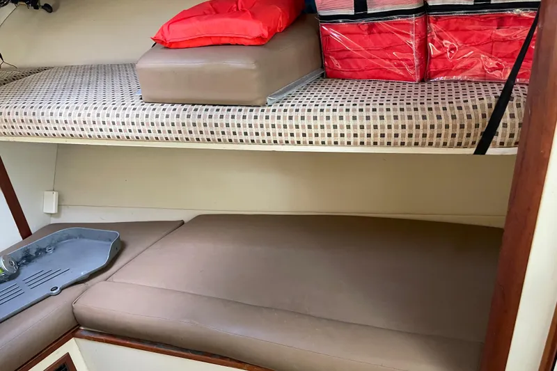 Slide: The Image of 2007 Luhrs 28 Open cabin interior with bunks and storage. - 86