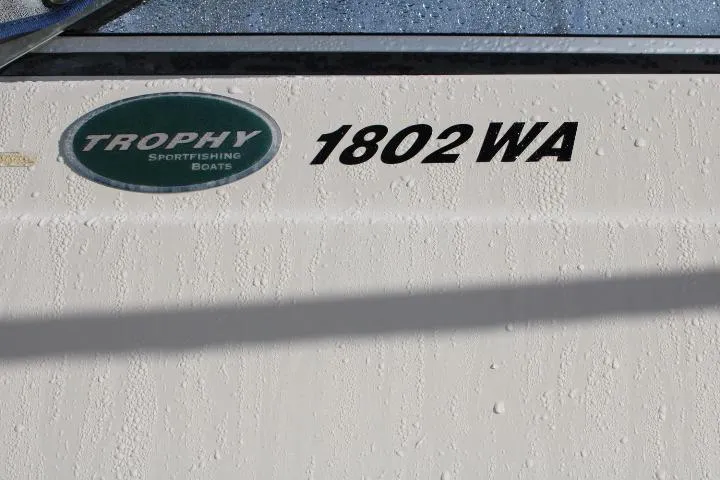 Slide: The Image of 2010 Trophy 1802 Walkaround boat with logo and model number visible. - 10