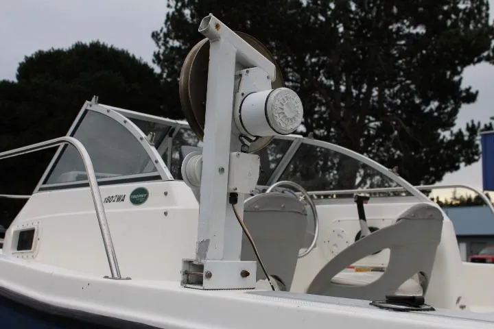 Slide: The Image of 2010 Trophy 1802 Walkaround boat with fishing equipment, white interior, and windshield. - 15