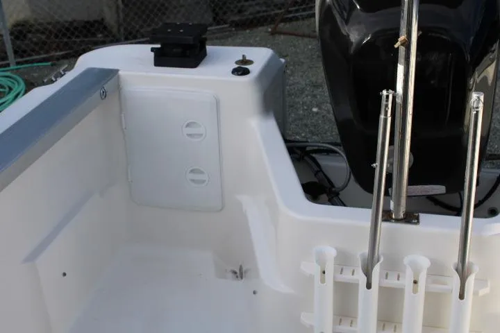 Slide: The Image of 2010 Trophy 1802 Walkaround boat interior with rod holders and engine mount. - 19