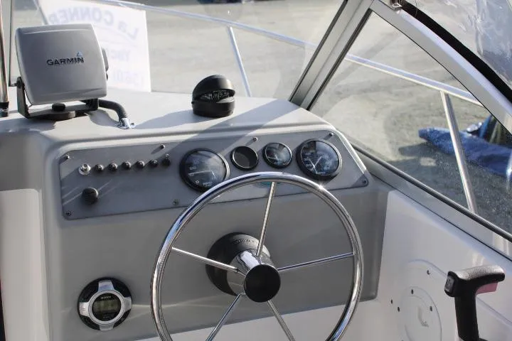 Slide: The Image of 2010 Trophy 1802 Walkaround boat dashboard with Garmin GPS and steering wheel. - 26