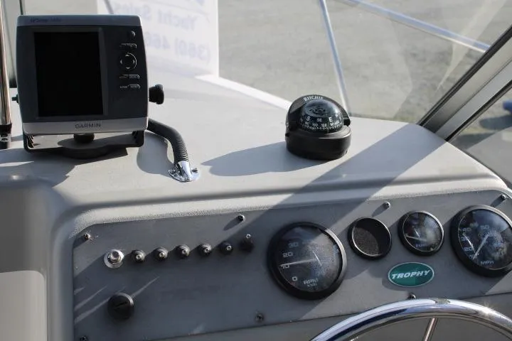Slide: The Image of Dashboard of a 2010 Trophy 1802 Walkaround boat with navigation instruments. - 27