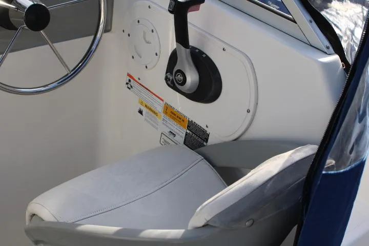 Slide: The Image of 2010 Trophy 1802 Walkaround boat interior with steering wheel and control panel. - 28