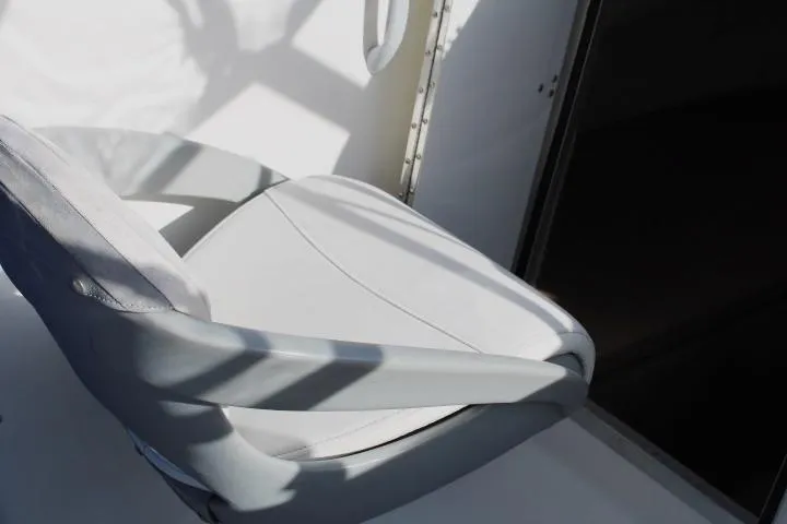 Slide: The Image of 2010 Trophy 1802 Walkaround boat seat, white upholstery, partial shadow. - 29