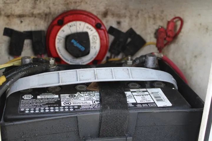Slide: The Image of Battery compartment of a 2010 Trophy 1802 Walkaround boat with wiring and switch. - 30