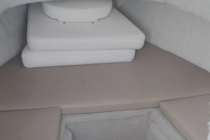 Slide: The Image of 2010 Trophy 1802 Walkaround cabin interior with cushioned seating. - 31