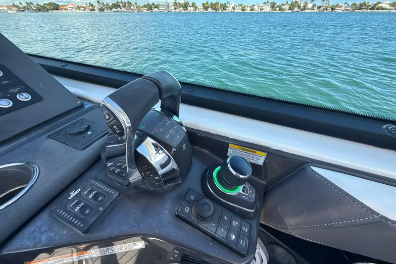 Slide: The Image of Control panel of a 2019 Monterey 385 Super Express boat with water view. - 17