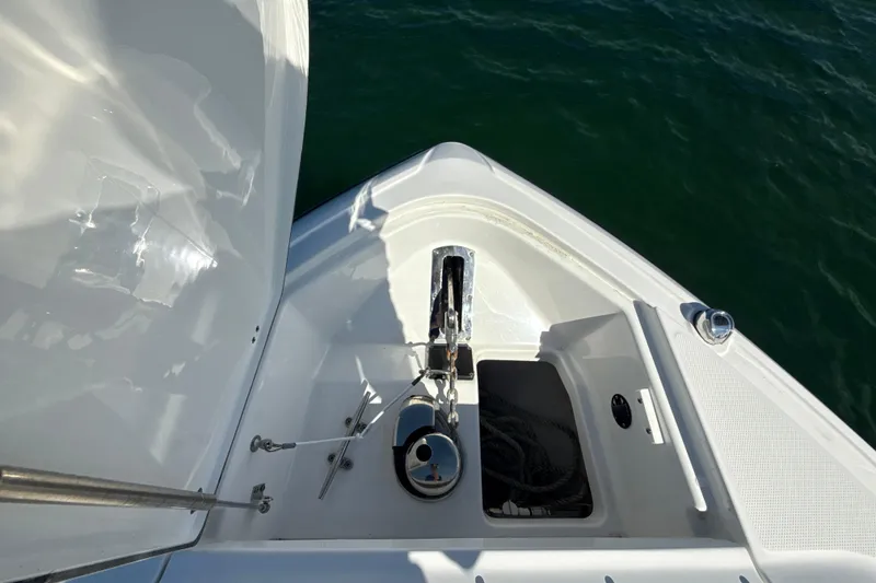 Slide: The Image of Bow view of 2019 Monterey 385 Super Express yacht with anchor and storage compartment. - 20