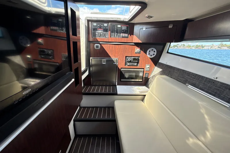 Slide: The Image of Interior of 2019 Monterey 385 Super Express yacht with modern amenities and sleek design. - 24