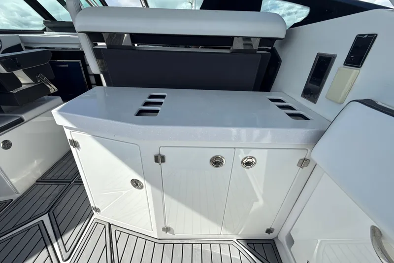 Slide: The Image of 2019 Monterey 385 Super Express yacht interior with sleek cabinetry and modern design. - 9