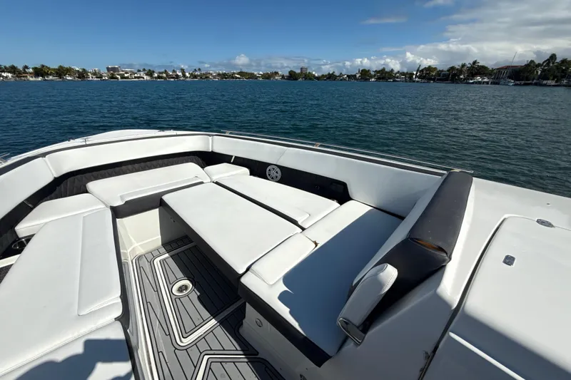 Slide: The Image of 2019 Monterey 385 Super Express boat with spacious seating on calm waters. - 18