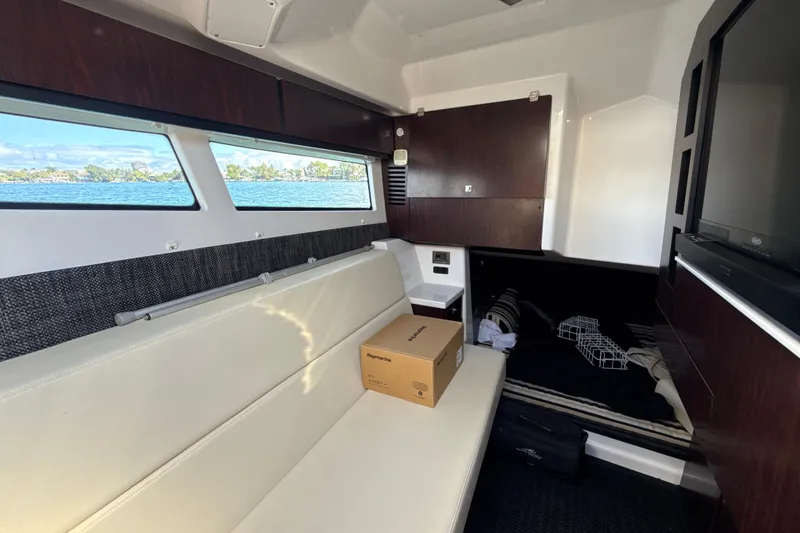 Slide: The Image of Interior of 2019 Monterey 385 Super Express yacht with seating and scenic windows. - 26