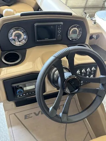 Slide: The Image of Evotti 521QL 2026 boat dashboard with steering wheel and controls. - 14
