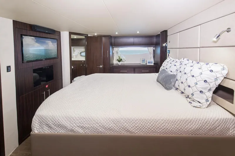 Slide: The Image of Interior of 2016 Regal 53 Sport Coupe yacht with modern helm and leather seating. - 10