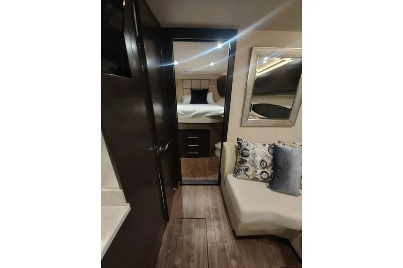 Slide: The Image of Interior of 2016 Regal 53 Sport Coupe with modern decor and cozy seating. - 16