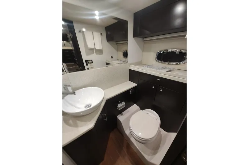 Slide: The Image of Luxurious bathroom in 2016 Regal 53 Sport Coupe yacht, featuring modern fixtures and elegant design. - 26
