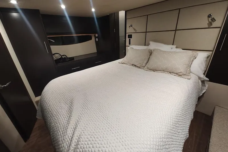 Slide: The Image of Luxurious bedroom interior of 2016 Regal 53 Sport Coupe yacht with elegant bedding. - 28