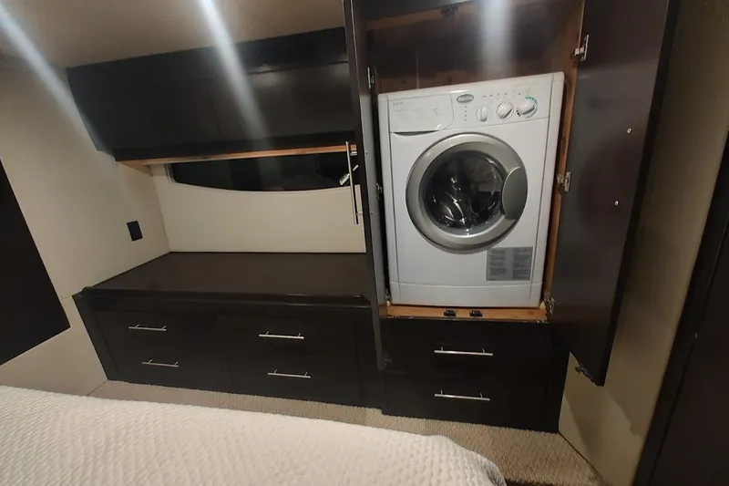 Slide: The Image of Interior of 2016 Regal 53 Sport Coupe with built-in washer and storage cabinets. - 29