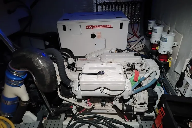 Slide: The Image of Engine room of a 2016 Regal 53 Sport Coupe with Westerbeke generator. - 33