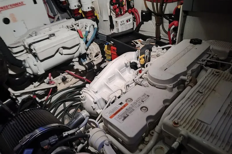 Slide: The Image of Engine room of a 2016 Regal 53 Sport Coupe with visible machinery and wiring. - 34