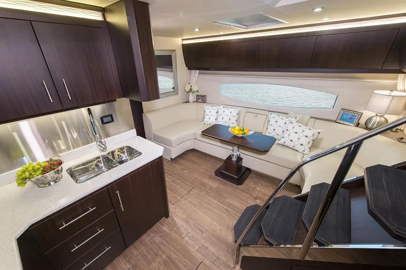 Slide: The Image of Manufacturer Provided Image: 2016 Regal 53 Sport Coupe yacht interior layout with bedrooms, kitchen, and living area. - 6