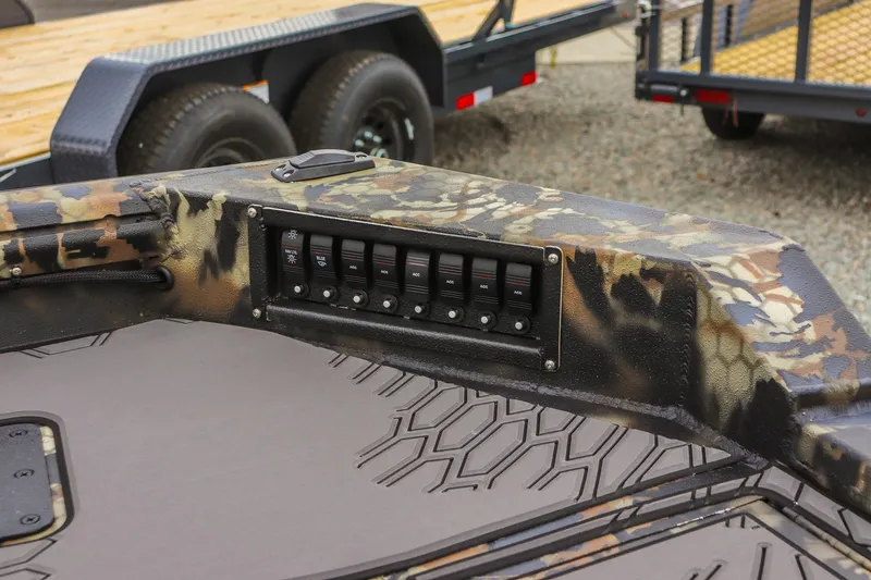 Slide: The Image of Camouflage-patterned Excel 1751 F4 boat dashboard with control switches, 2026 model. - 13