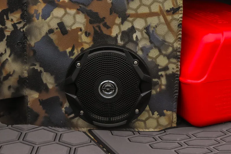 Slide: The Image of Camouflage speaker and red container on Excel 1751 F4, 2026 model. - 15
