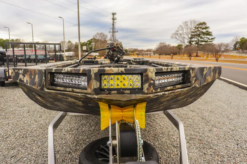 Slide: The Image of Camouflage-patterned 2026 Excel 1751 F4 boat with LED lights on a trailer. - 7