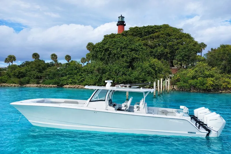 The Image of Front Runner 43 Catamaran 2026 near lighthouse and tropical island. - 0