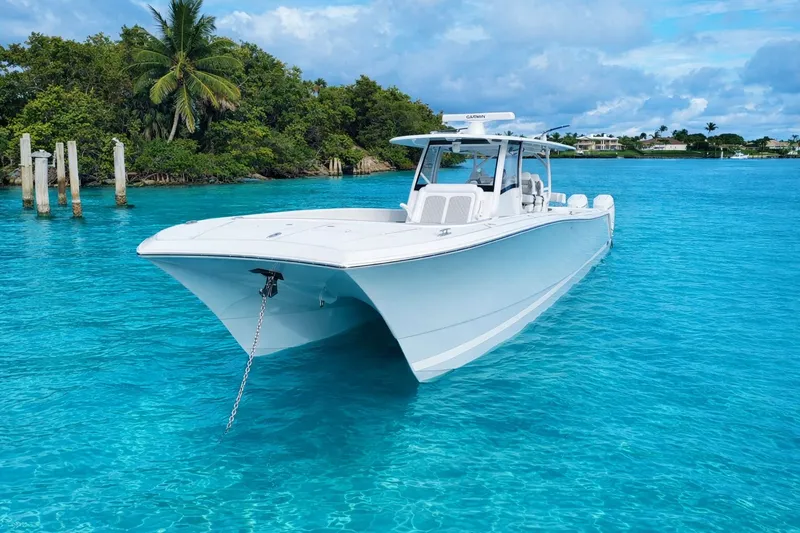 Slide: The Image of Front Runner 43 Catamaran 2026 on clear turquoise water. - 2