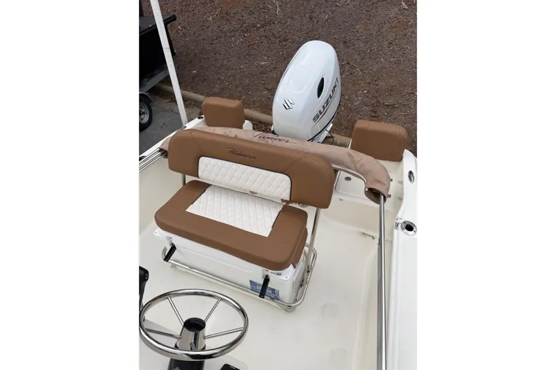 Slide: The Image of 2026 Pioneer 180 Islander boat interior with brown and white seating, Suzuki outboard motor. - 4