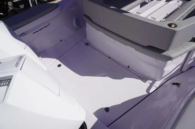 Slide: The Image of 2025 Axopar 29 Sun-Top boat interior with seating and deck details. - 19