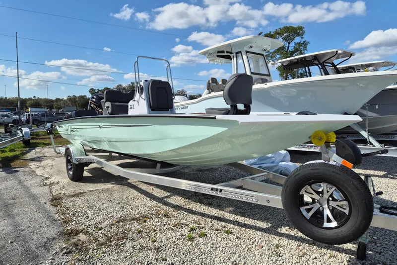 The Image of 2026 Xpress H20B Bay boat on trailer under a clear blue sky. - 0