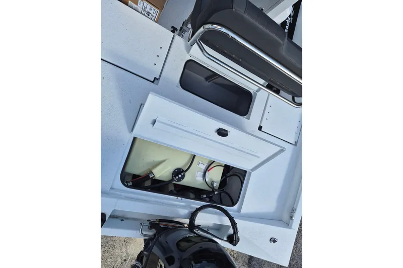 Slide: The Image of 2026 Xpress H20B Bay boat interior showing storage compartment and seating. - 15