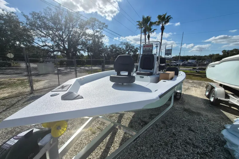 Slide: The Image of 2026 Xpress H20B Bay boat on trailer under sunny sky, ready for adventure. - 3