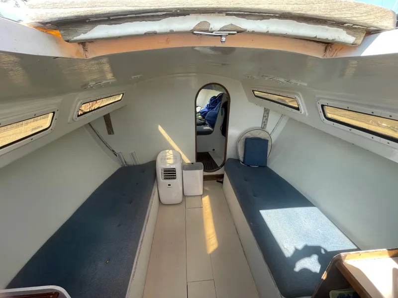 Slide: The Image of Interior of 1983 J Boats J/35 sailboat with seating and windows. - 10