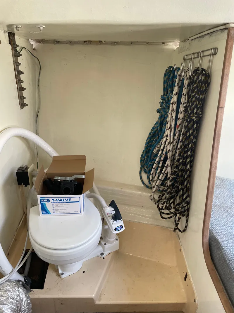 Slide: The Image of Interior of a 1983 J/35 yacht with toilet and ropes. - 12