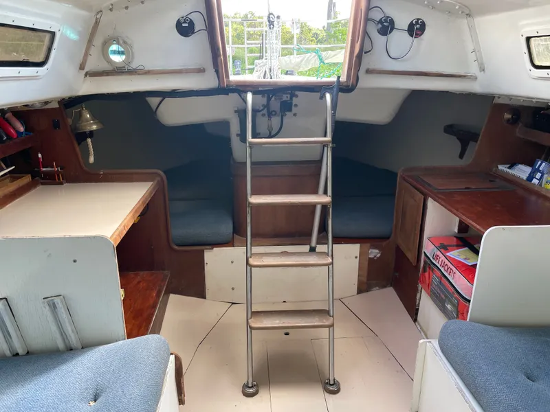 Slide: The Image of Interior of a 1983 J Boats J/35 yacht with wooden furnishings. - 16