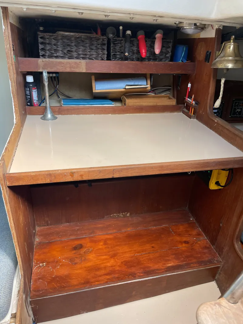 Slide: The Image of J/35 sailboat interior desk with tools and storage, 1983 model. - 19