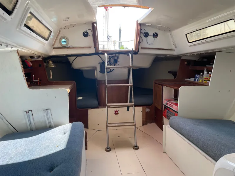 Slide: The Image of Interior of 1983 J Boats J/35 sailboat with seating and ladder. - 9