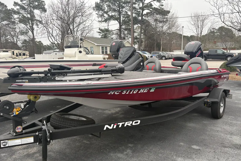 The Image of 2025 Nitro Z17 boat with Minn Kota motor on trailer, parked outdoors. - 0