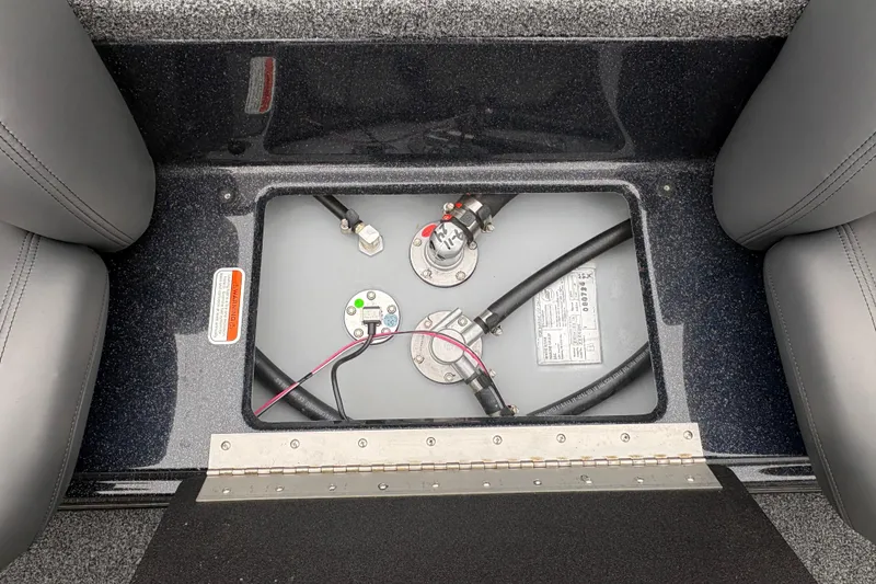 Slide: The Image of Fuel tank compartment of a 2025 Nitro Z17 boat, showing hoses and connections. - 13