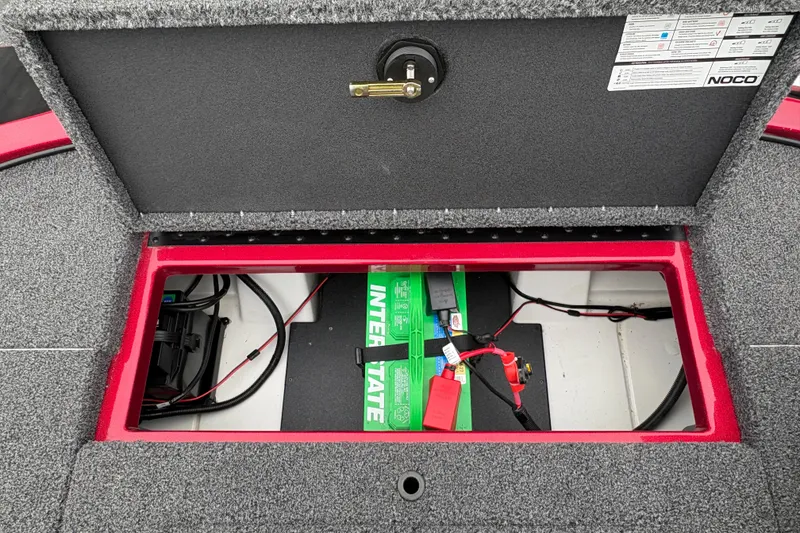 Slide: The Image of Open battery compartment of 2025 Nitro Z17 boat, featuring Interstate battery and wiring. - 16