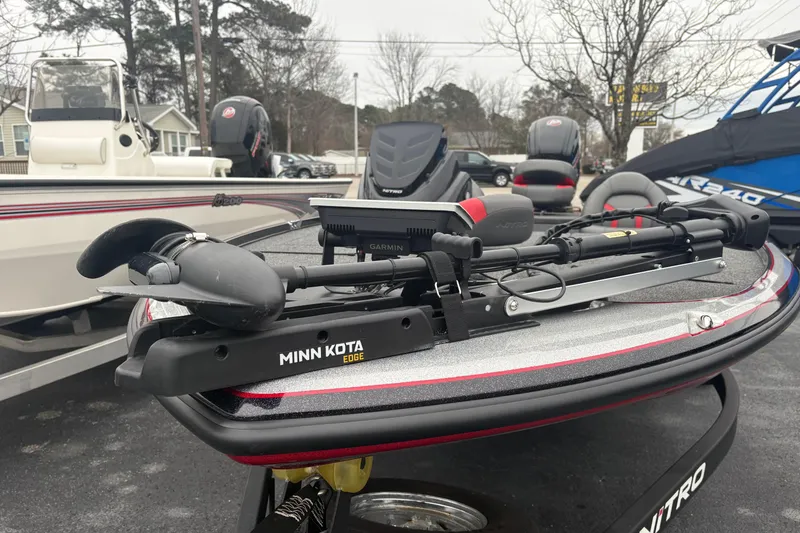Slide: The Image of Nitro Z17 2025 boat with Minn Kota Edge trolling motor in a dealership lot. - 4