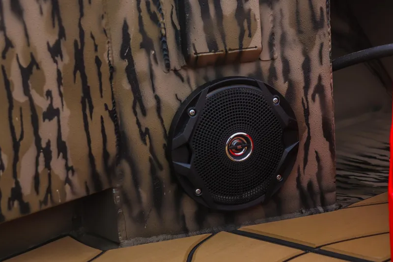 Slide: The Image of Speaker installed in 2026 Excel 1754 Shallow Water F4 boat with camouflage design. - 11