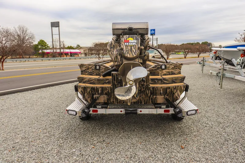 Slide: The Image of 2026 Excel 1754 Shallow Water F4 boat with camo design on a trailer. - 3