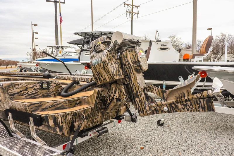 Slide: The Image of 2026 Excel 1754 Shallow Water F4 boat with camouflage design on display. - 7