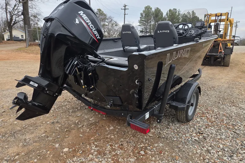 Slide: The Image of 2023 Lund 1650 Rebel XL Sport boat with Mercury outboard motor on a trailer. - 4