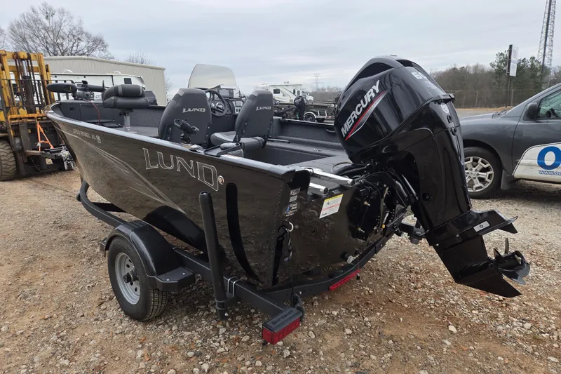 Slide: The Image of 2023 Lund 1650 Rebel XL Sport boat with Mercury outboard motor on a trailer. - 6